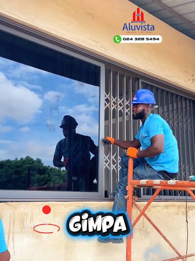 Aluvista installer fitting a window at GIMPA